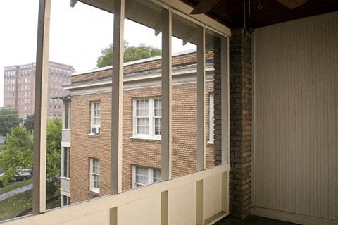 A view of a building through a window.