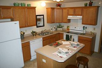 Gourmet Kitchen With Island at Cypress Court Apartments, Baxter, MN - Photo Gallery 2