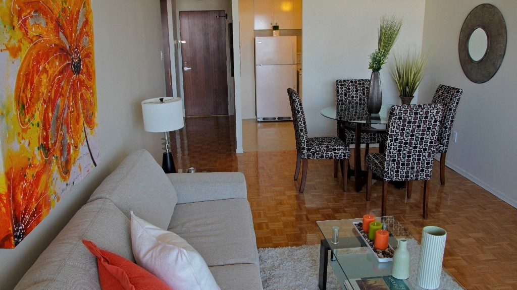 a living room and dining room with a couch and a table