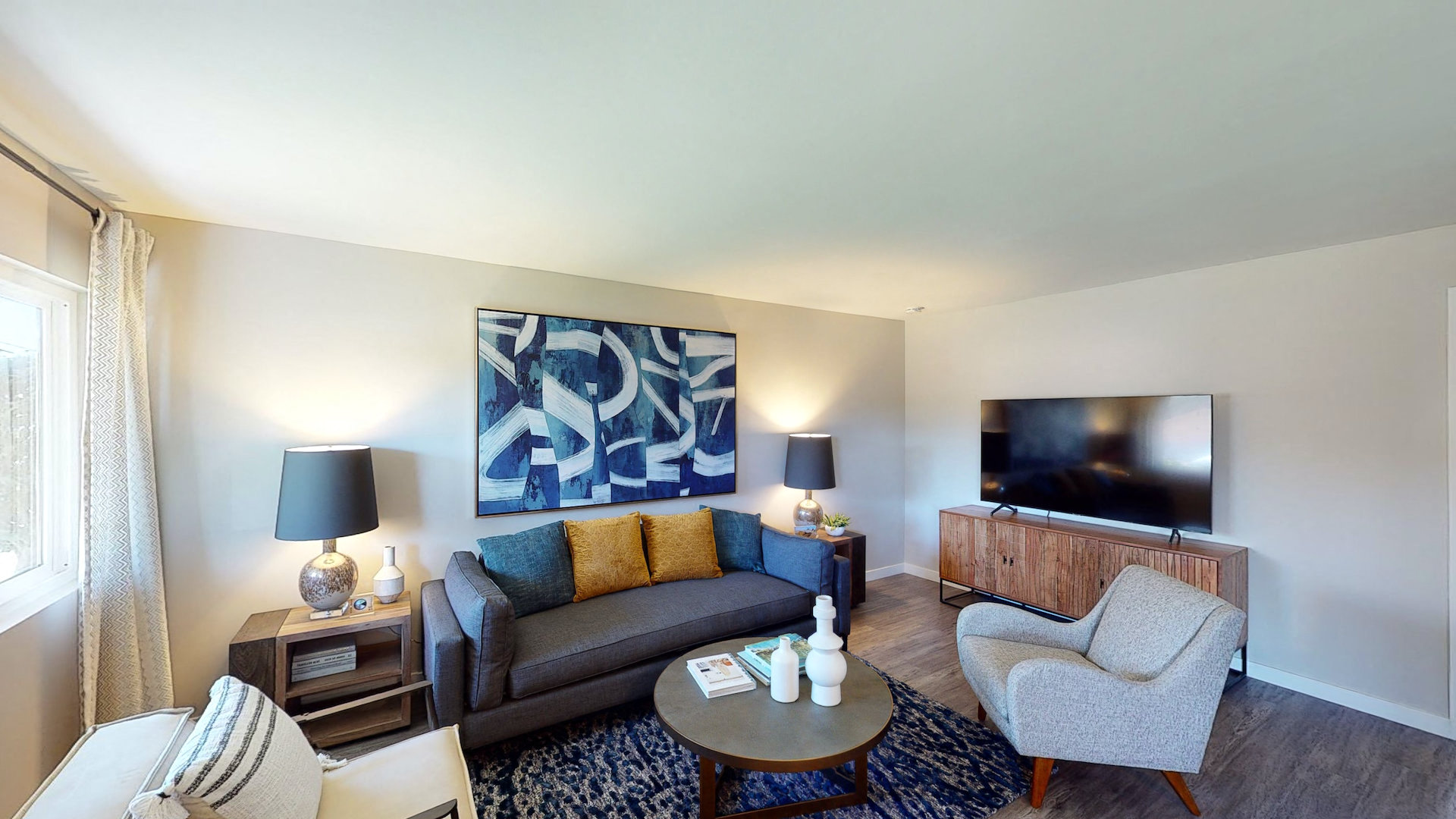 a living room with a couch and a tv