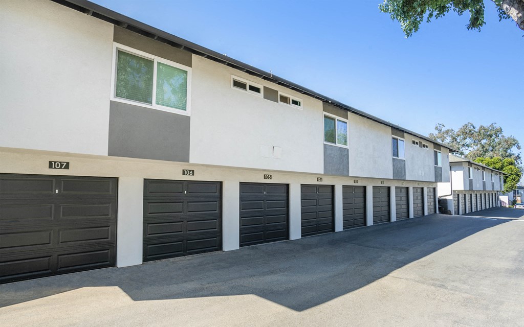 a row of garage doors on the side of a building