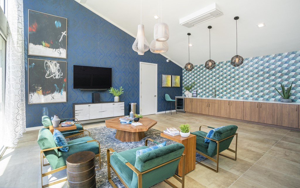 a living room with blue walls and blue furniture
