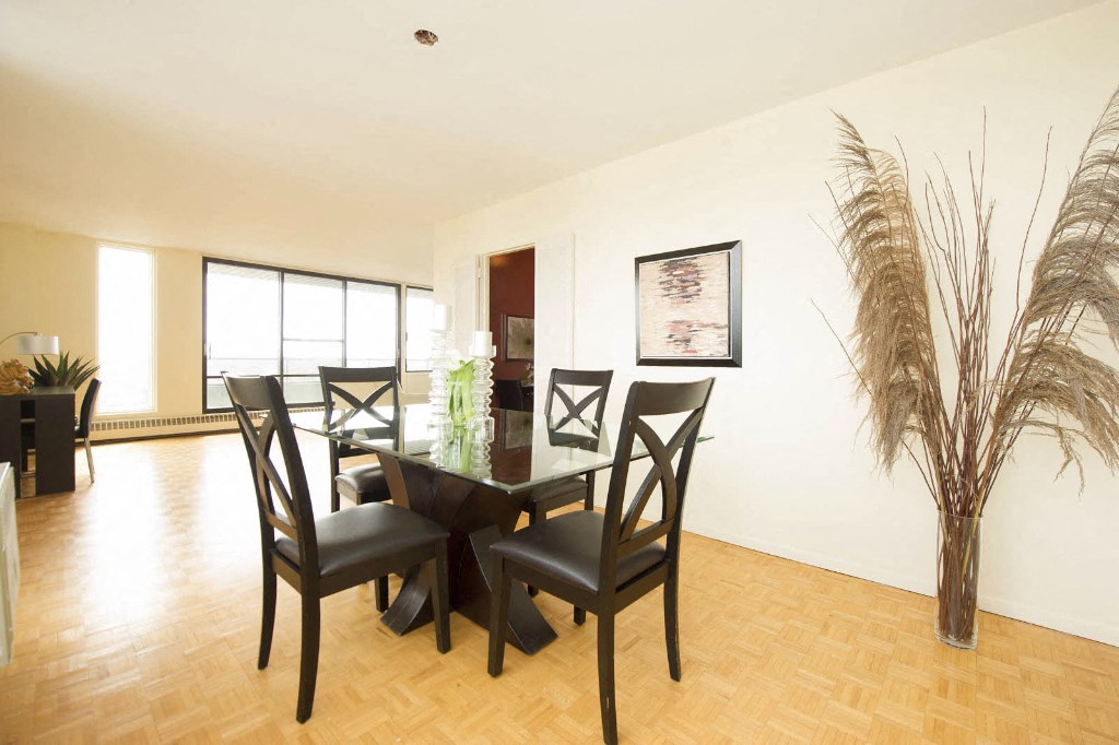 a dining room with a table and chairs