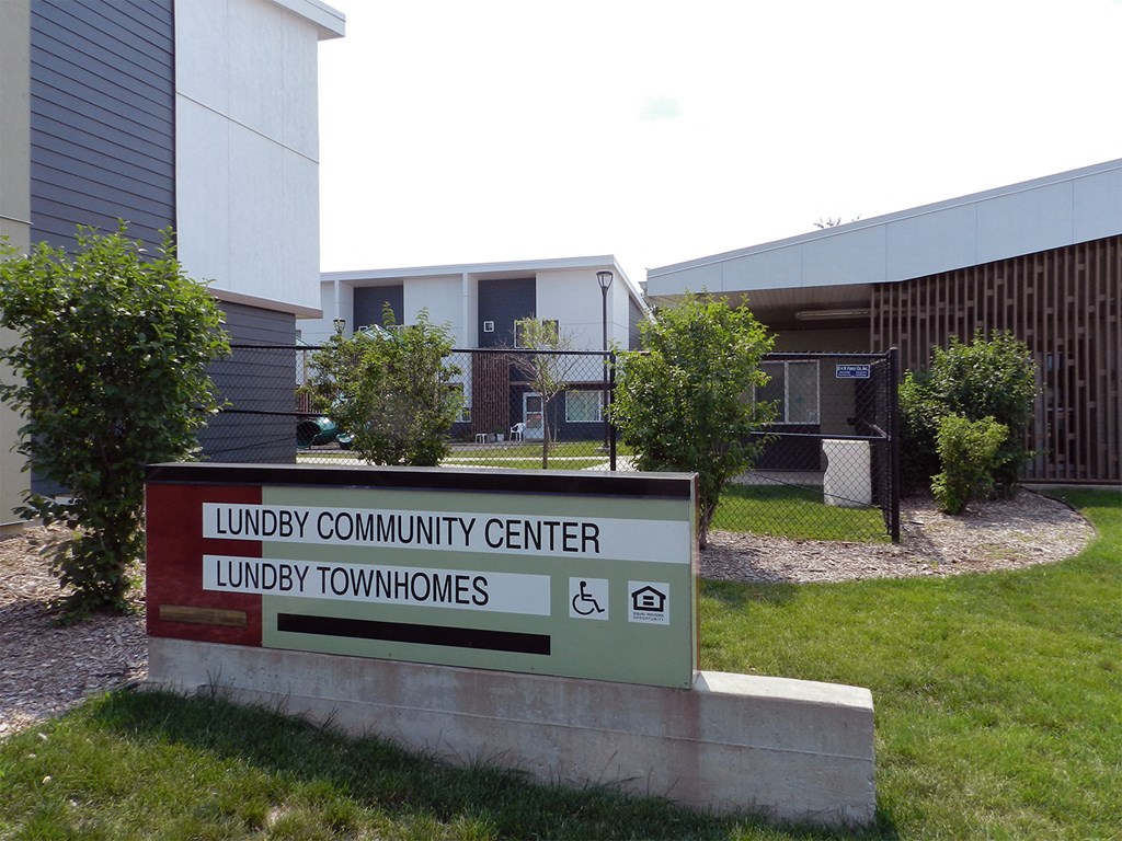 a sign in front of a building