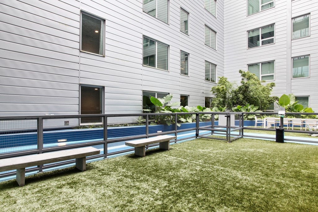 a communal area with benches in front of a building