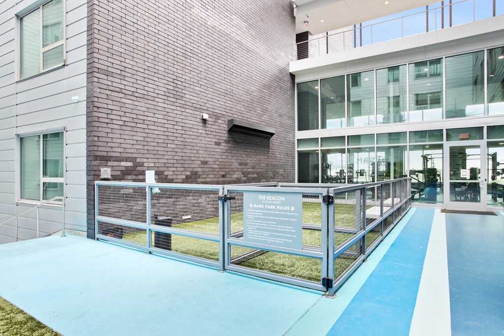 a ramp in front of a brick building with a sign on it