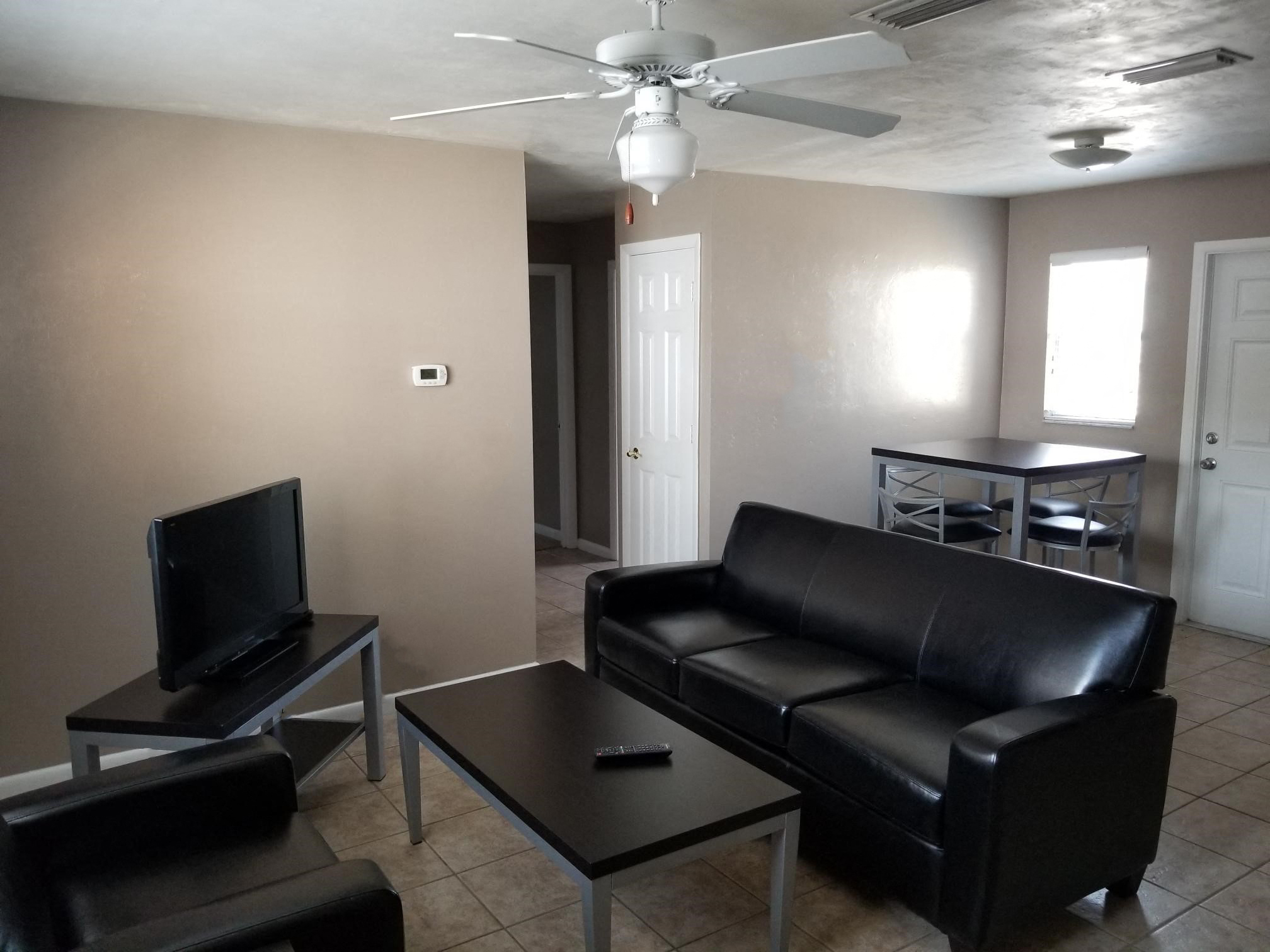 a living room with a couch and a tv