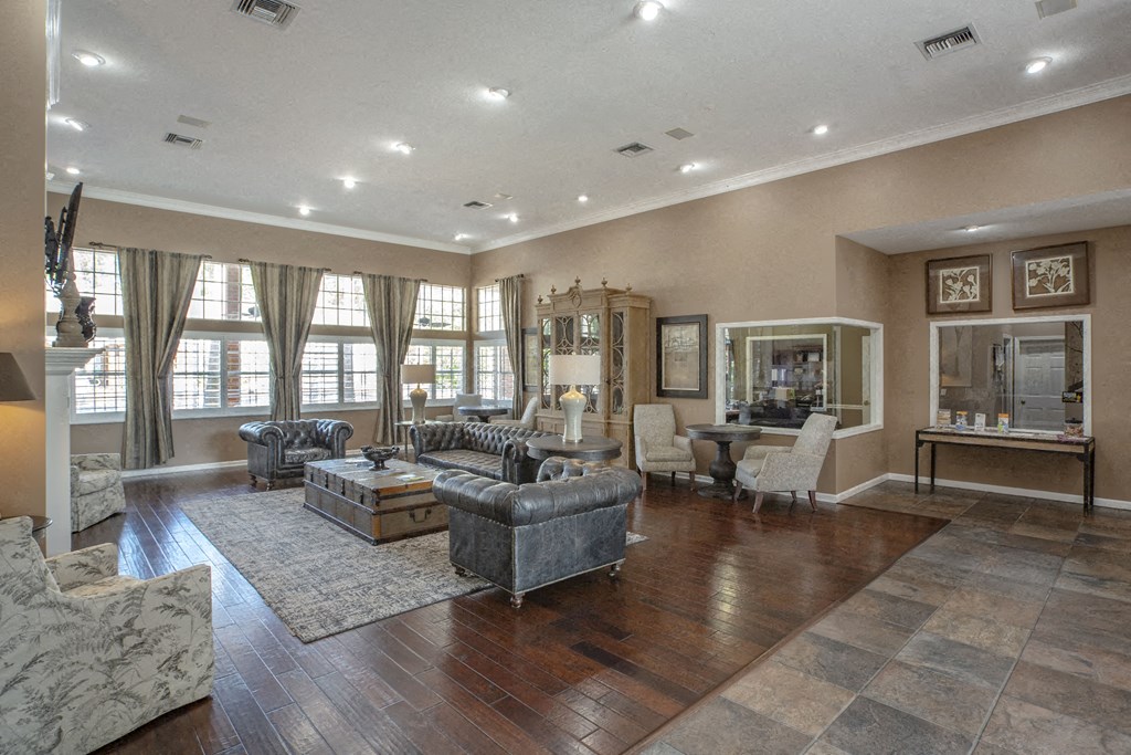 the living room has a fireplace and hardwood floors