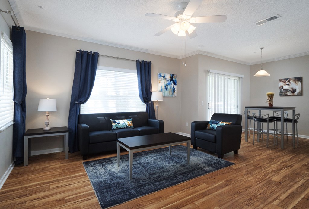a living room with couches and a coffee table