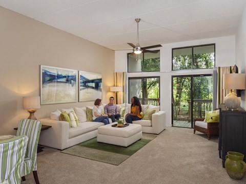 two people sitting on a couch in a living room