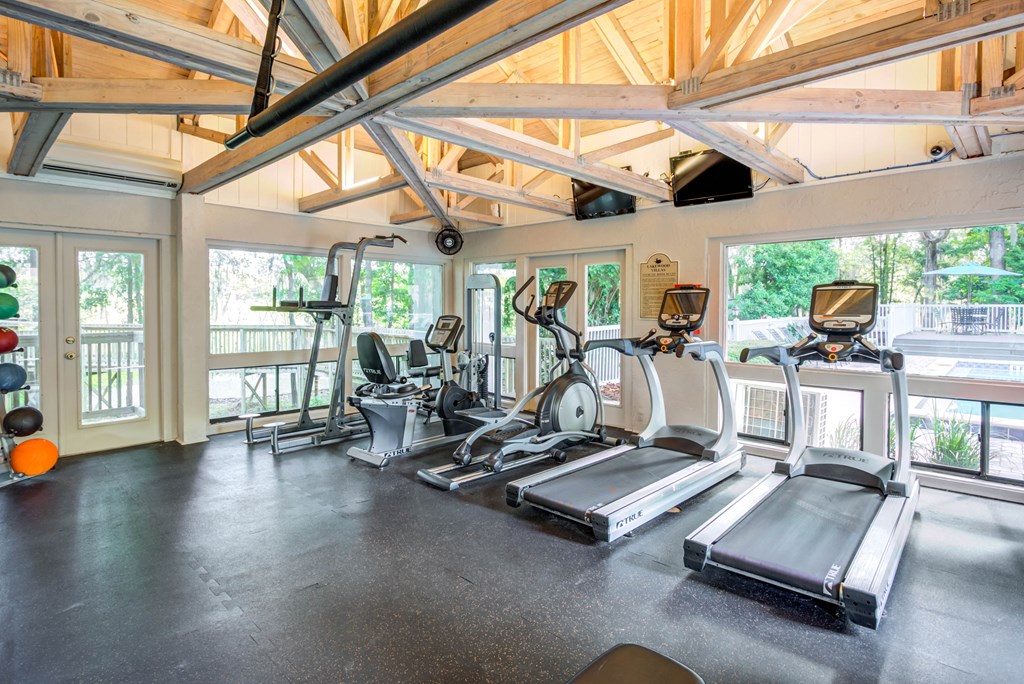 the gym with treadmills and other exercise equipment at 1861 blissful heights apartments