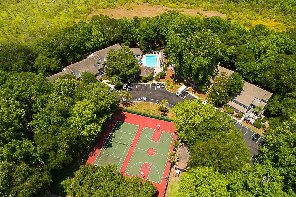 a aerial view of a basketball court and some houses