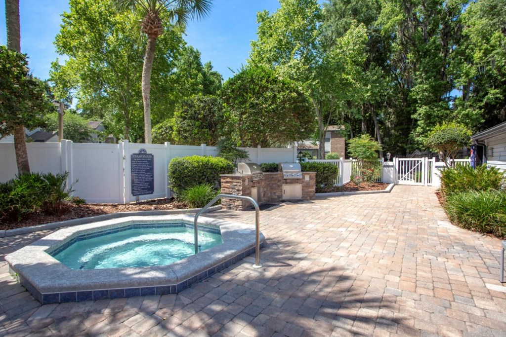 a jacuzzi in the backyard of a house