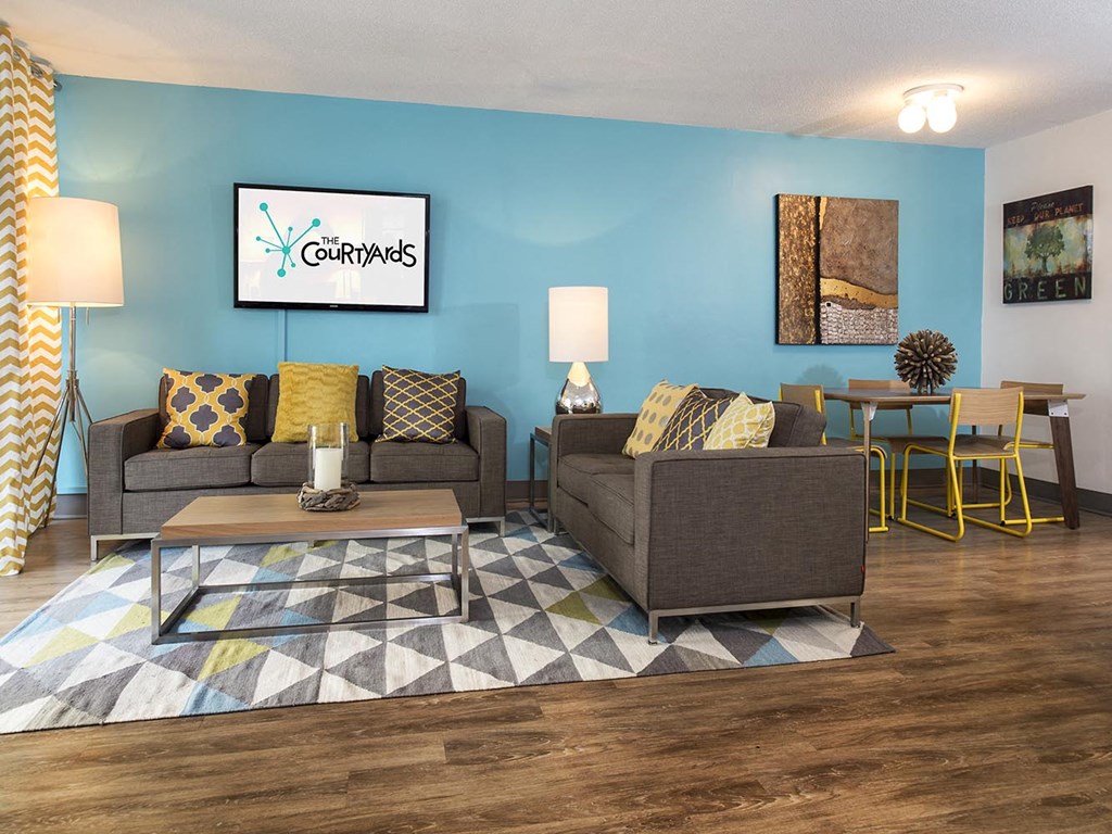 a living room with couches and a table