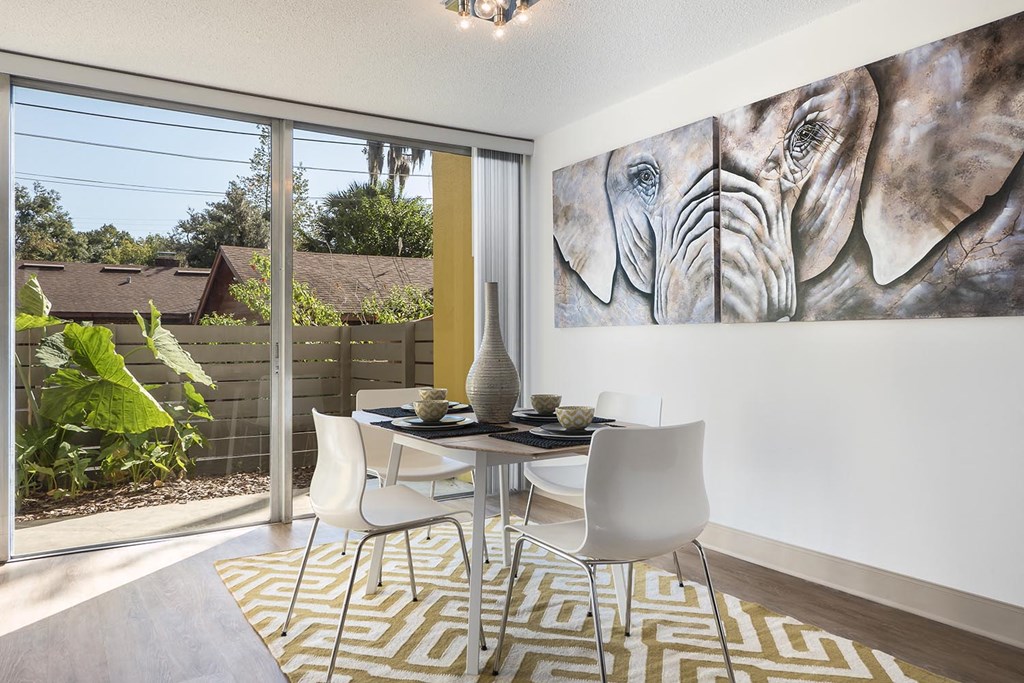 a dining room with a table and chairs
