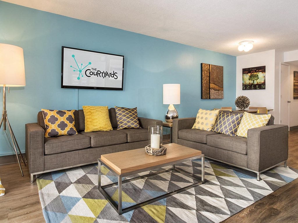 a living room with couches and a coffee table