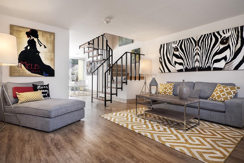 a living room with a couch and a table