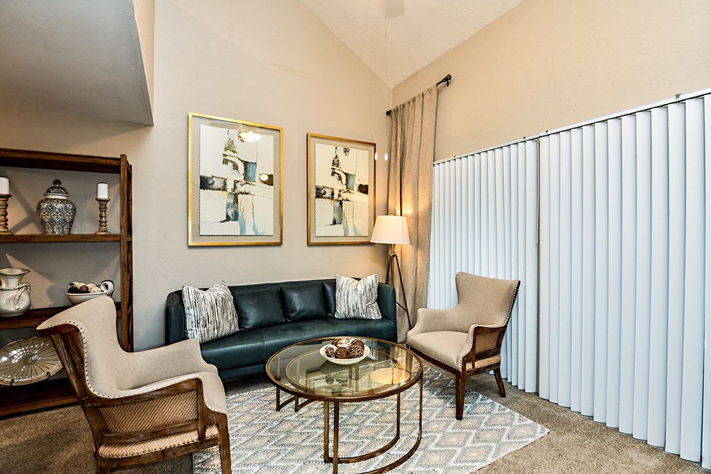 a living room with a couch and two chairs