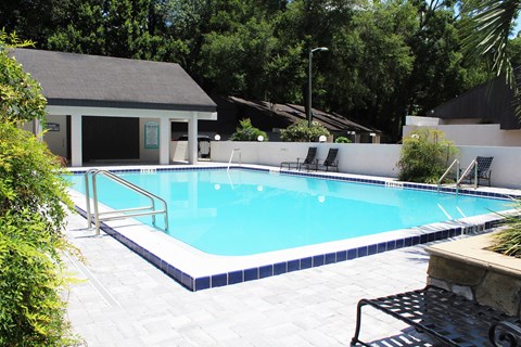 a swimming pool in front of a house