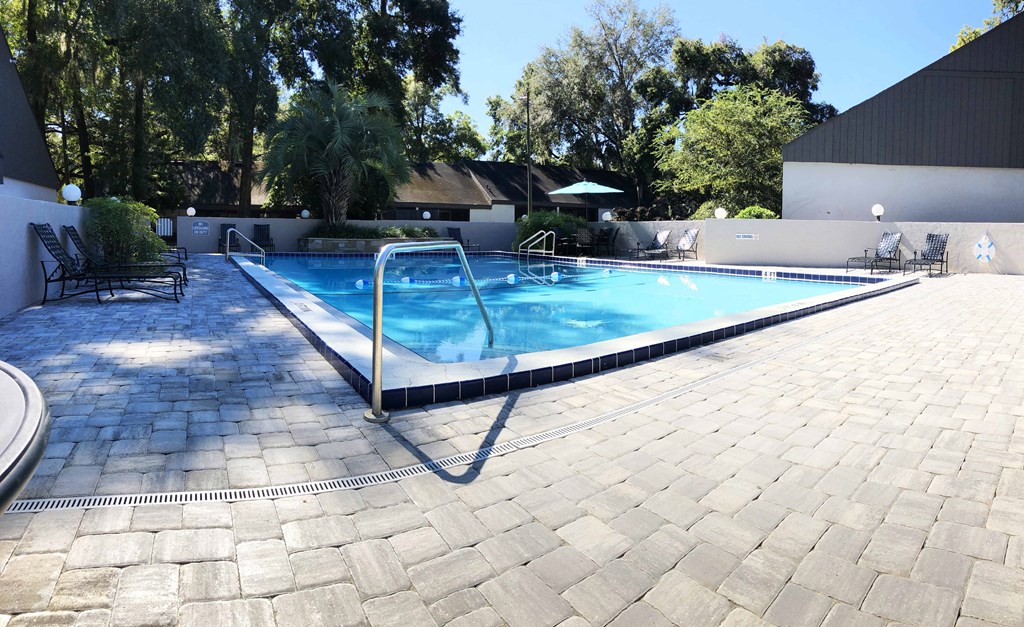 a swimming pool in the backyard of a house