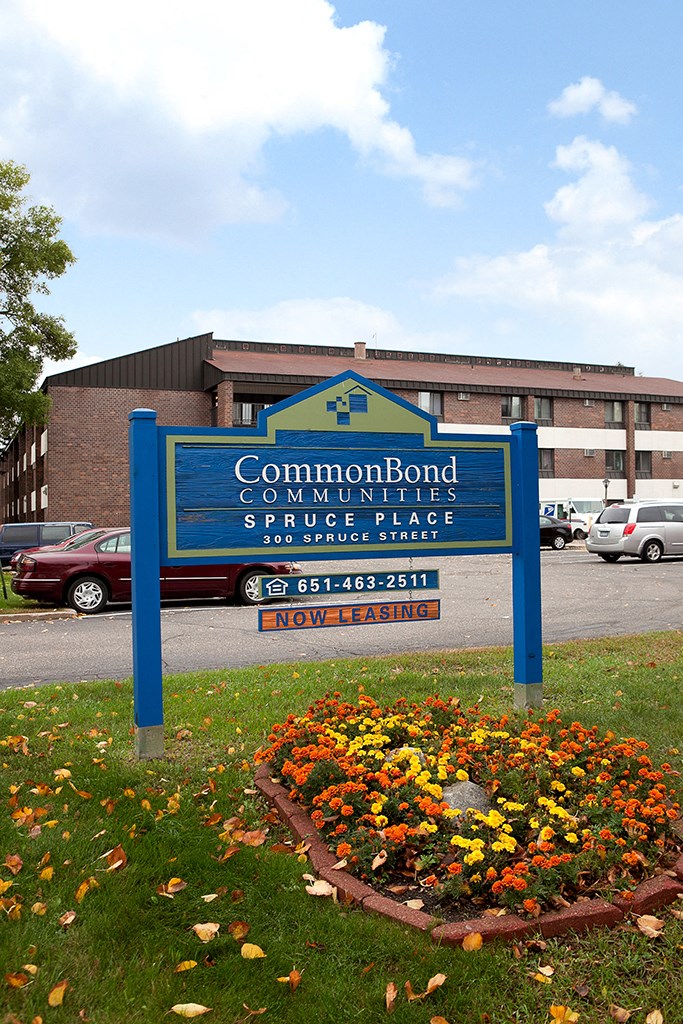 a sign in front of a building