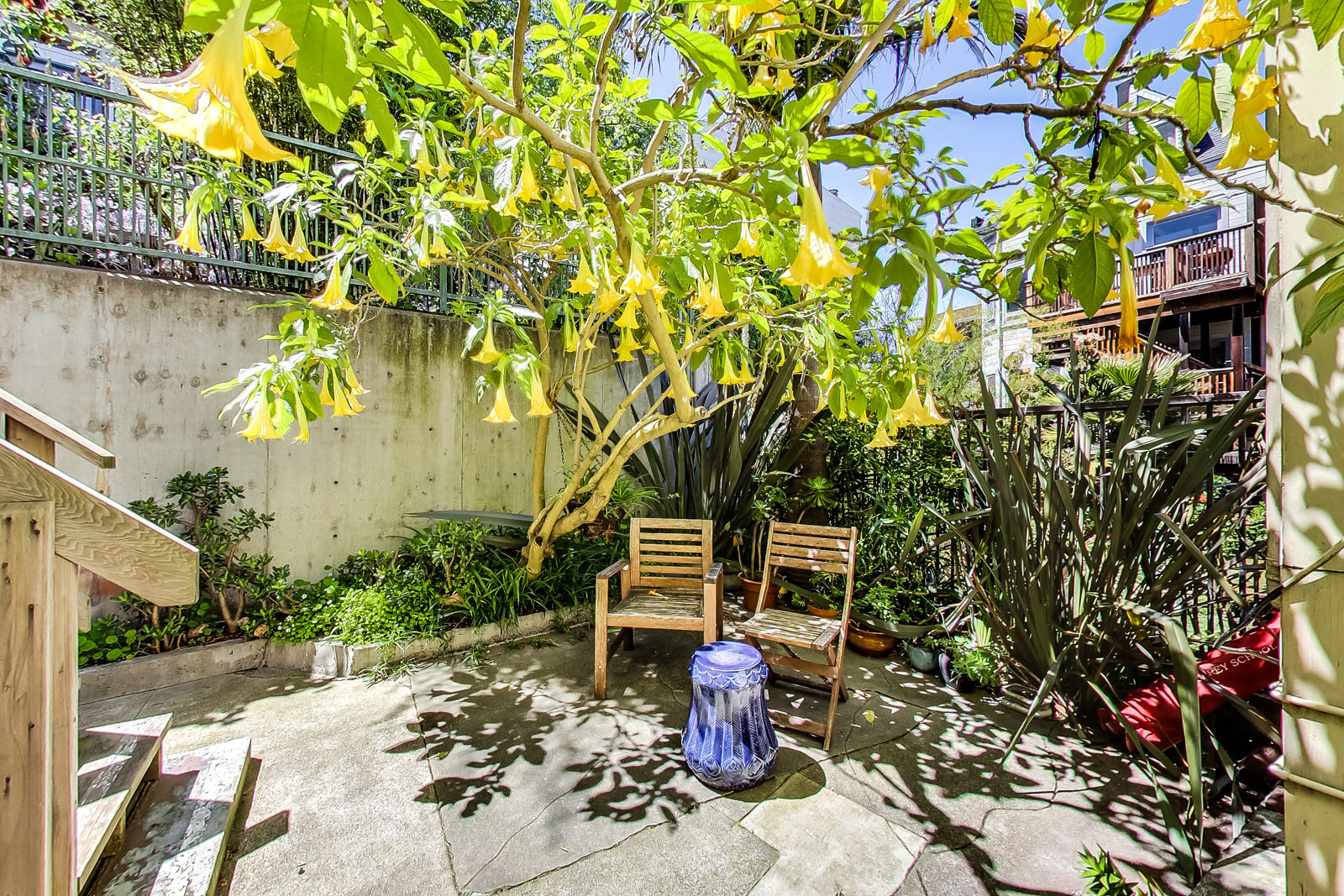 A small patio with a chair and table.