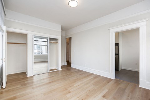 A room with wooden floors and white walls.