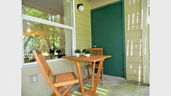 Wooden chair and bench at Commons at Creekside Apartments, Oregon