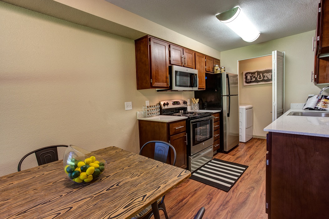 our apartments have a kitchen and dining room with a table