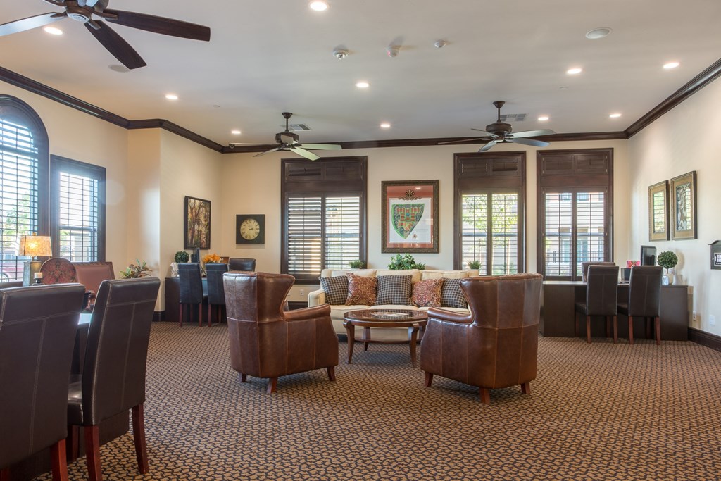a large living room with couches chairs and a table