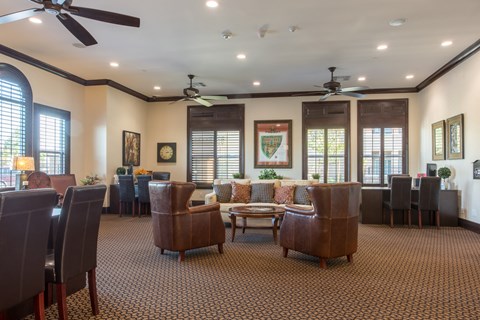 a large living room with couches chairs and a table