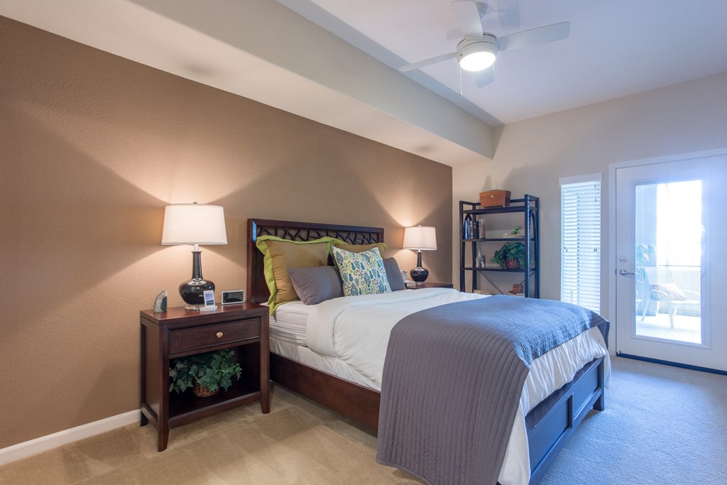 a bedroom with a bed and two night stands