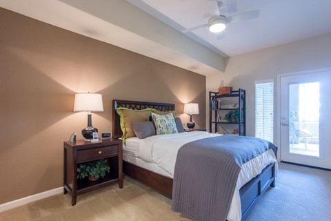 a bedroom with a bed and two night stands