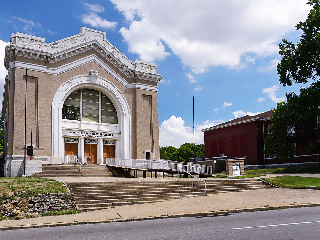 a large brick building with stairs in front of it