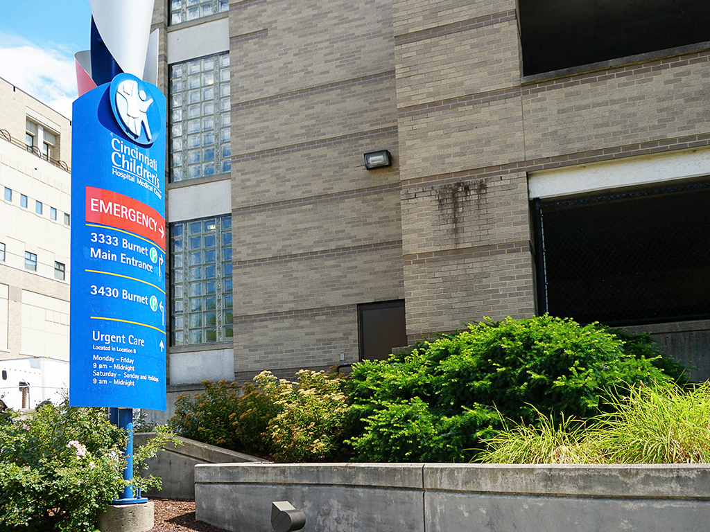 a blue sign in front of a building