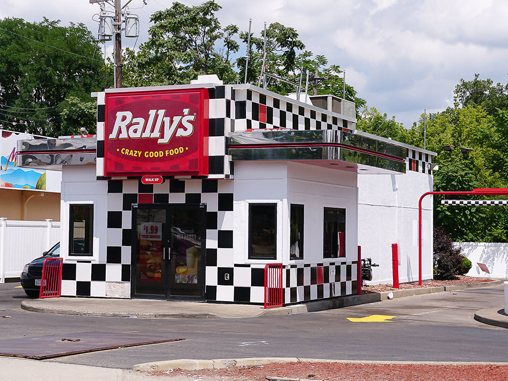 a restaurant with a black and white checkered facade
