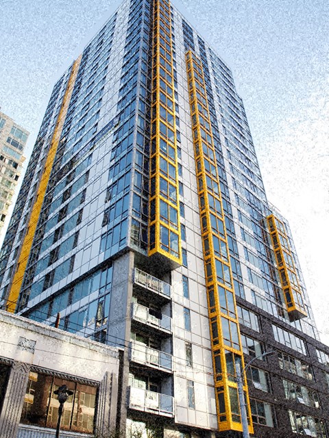 a tall building with a yellow ladder on the side of it