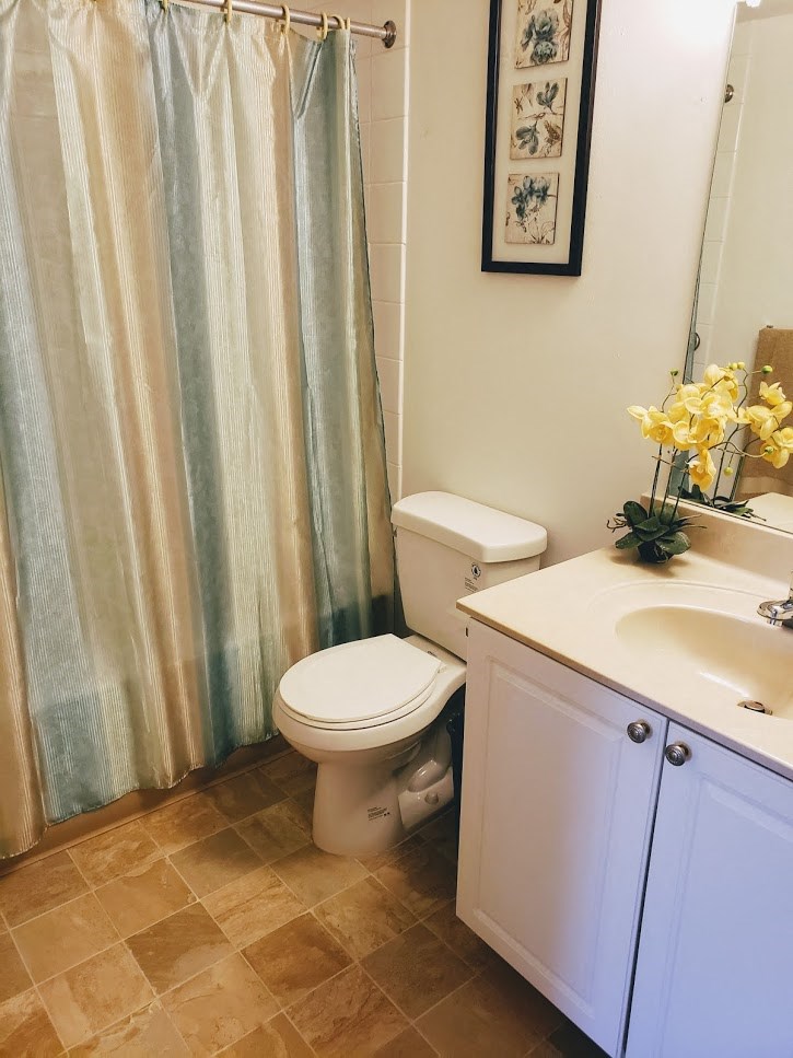a bathroom with a toilet and a sink