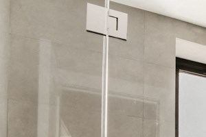 a bathroom with a shower and a sink and a mirror