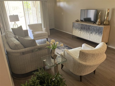 a living room with a couch and a table and a television