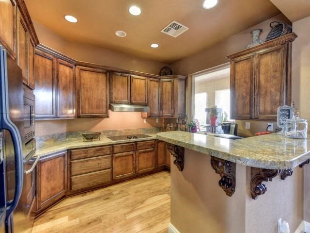 a kitchen with wooden cabinets and a counter top