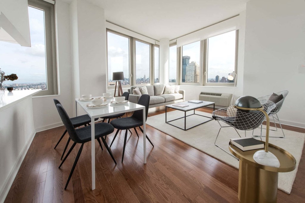 a living room with a table and chairs and a couch
