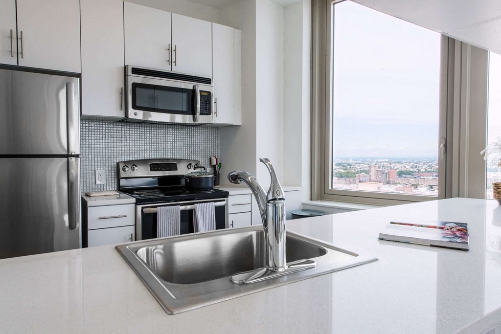 a kitchen with a sink and a window