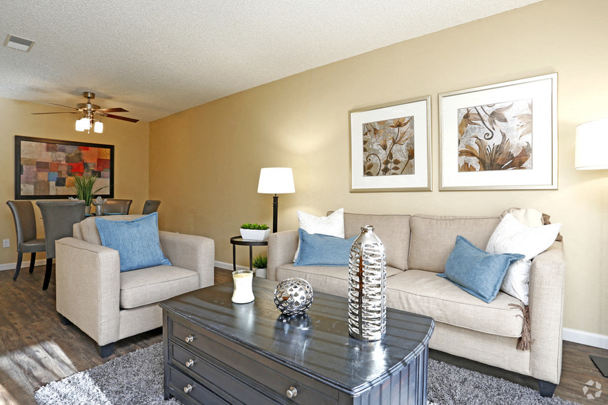 a living room with a couch and a table