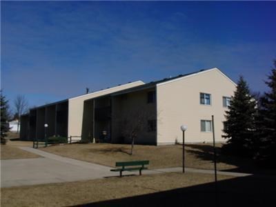 a building with a park bench in front of it