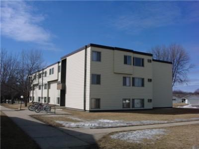 an apartment building with bikes parked in front of it