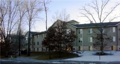 an apartment building in the winter with snow