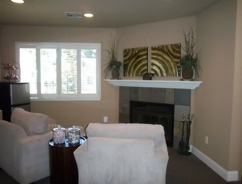 a living room with a couch and a fireplace