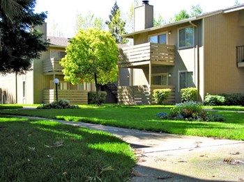 Exterior building grounds l Apartments in Stockton | Pacific Commons Apartment Homes - Photo Gallery 2