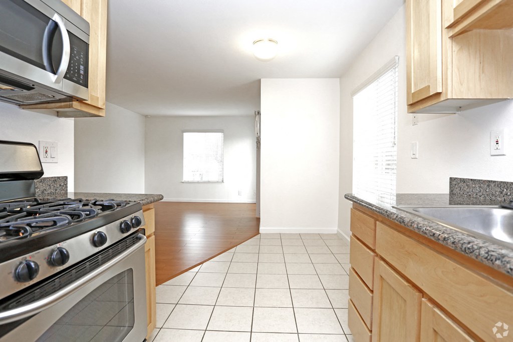 Kitchen with view of living area at PARKSIDE BRENTWOOD, Brentwood California